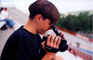 Noah as a teenager with a video camera