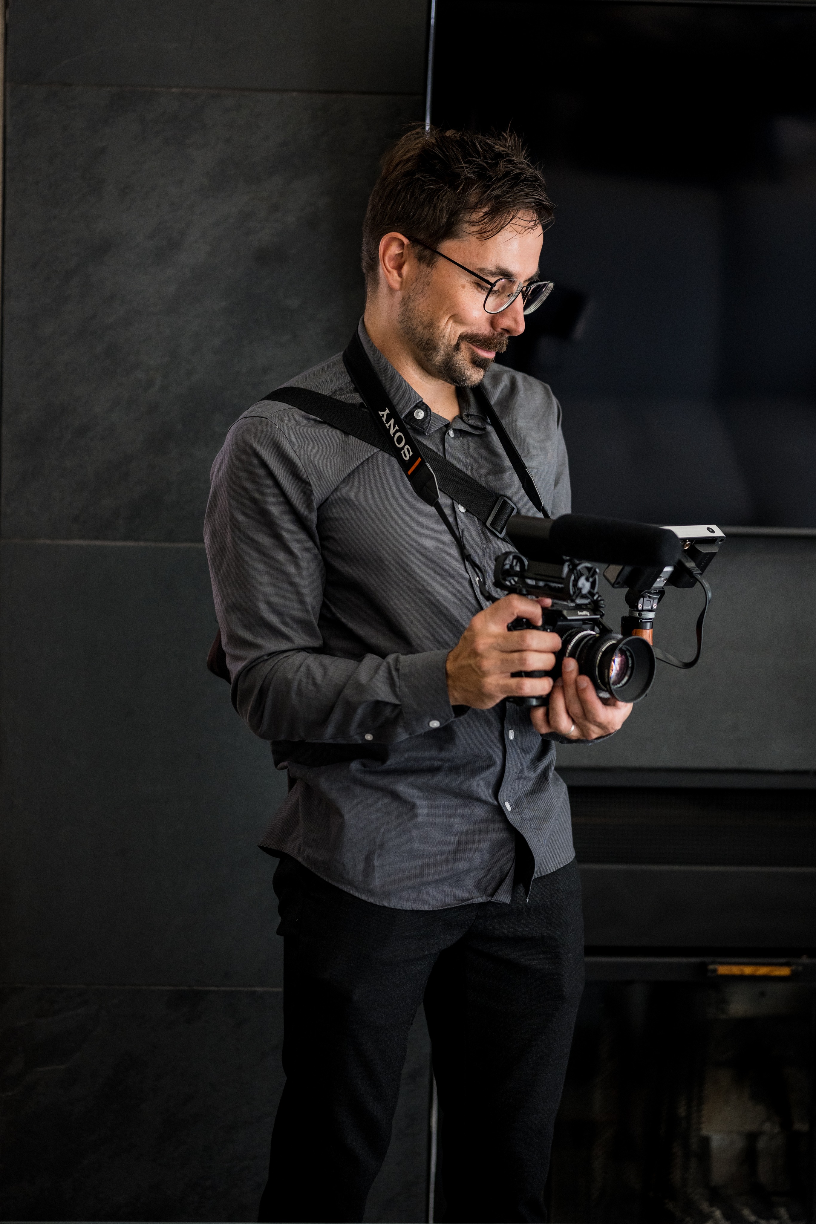 Noah holding a camera.